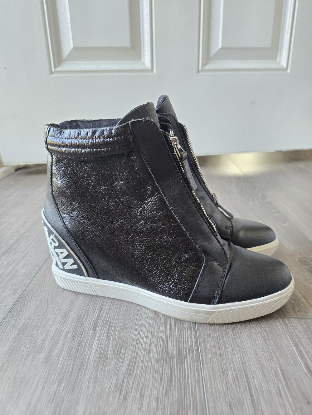 DKNY Black Leather Zip Front Hidden Wedge High Top Sneakers Logo Heel Size 8.5